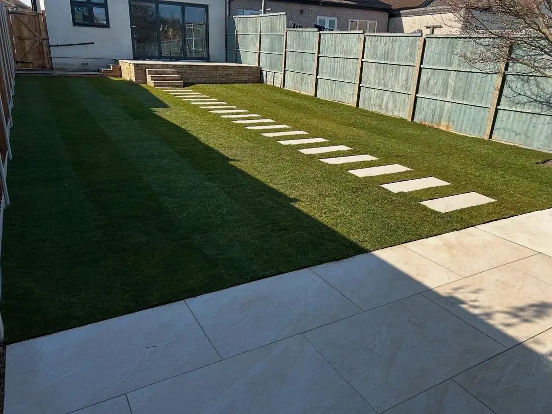 Landscaped garden with artificial grass paving and stepping stones Burton